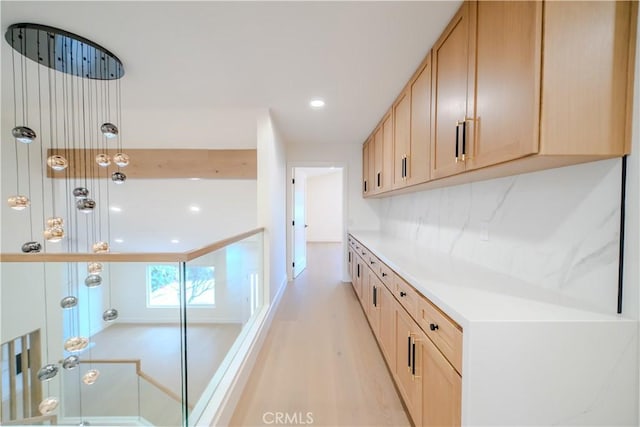 24701 Sarah Ln, Lake Forest, CA 92630 - kitchen with light countertops, recessed lighting, light wood-style floors, light brown cabinetry, and hanging light fixtures