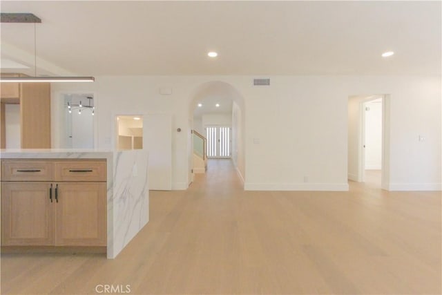 24701 Sarah Ln, Lake Forest, CA 92630 - kitchen featuring arched walkways, light wood-style flooring, light countertops, recessed lighting, and baseboards