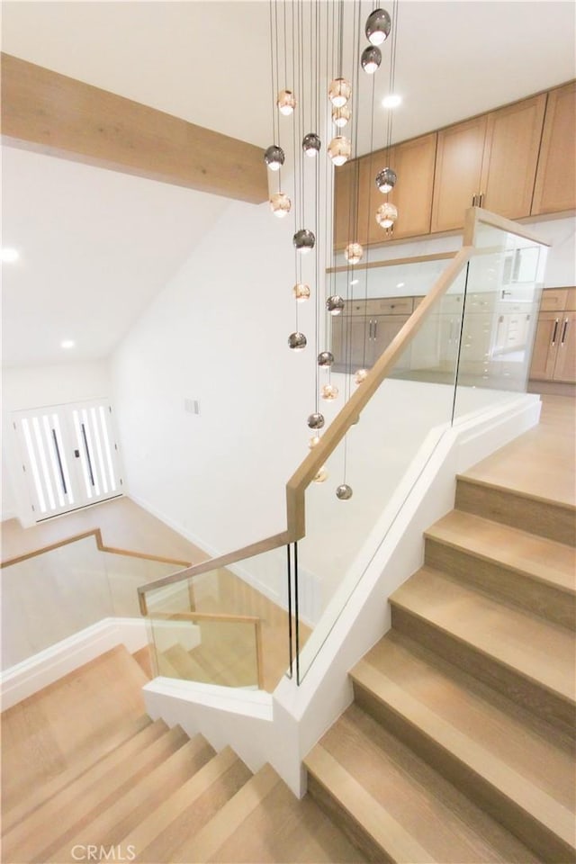 staircase with recessed lighting and baseboards
