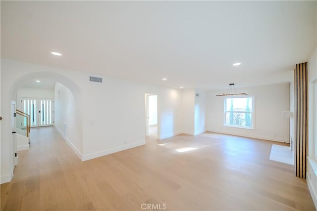 24701 Sarah Ln, Lake Forest, CA 92630 - empty room with arched walkways, light wood-type flooring, recessed lighting, and baseboards