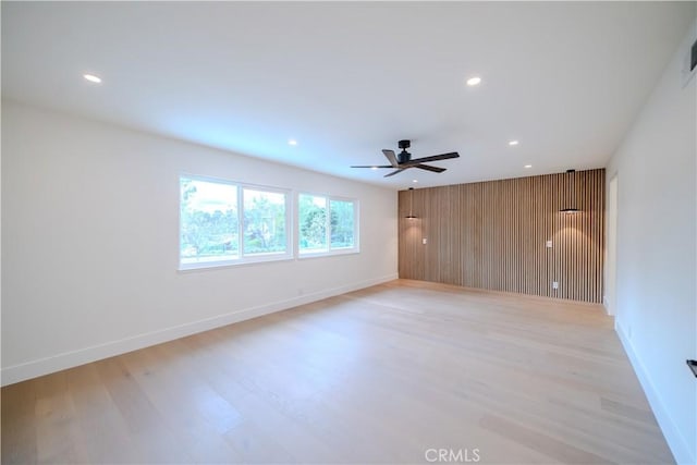 24701 Sarah Ln, Lake Forest, CA 92630 - spare room featuring light wood-type flooring, recessed lighting, ceiling fan, baseboards, and wood walls
