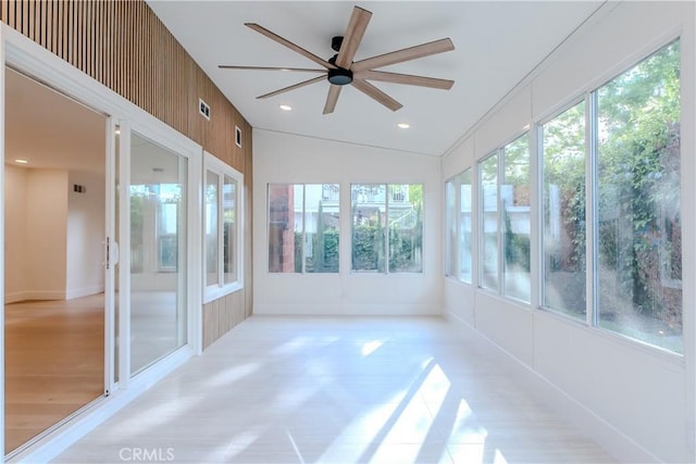 unfurnished sunroom featuring wood finished floors and recessed lighting