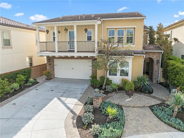 47 Cielo Azul, Mission Viejo, CA 92692 - view of front of home featuring concrete driveway, stucco siding, and a garage