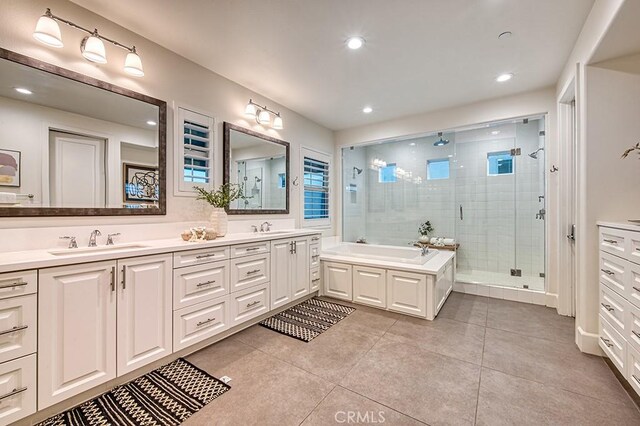 47 Cielo Azul, Mission Viejo, CA 92692 - bathroom featuring double vanity, a stall shower, tile patterned flooring, and recessed lighting