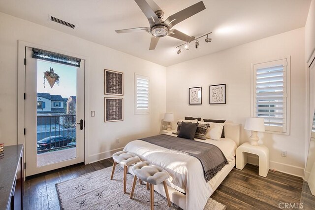 47 Cielo Azul, Mission Viejo, CA 92692 - bedroom with track lighting, access to exterior, dark wood-type flooring, and baseboards