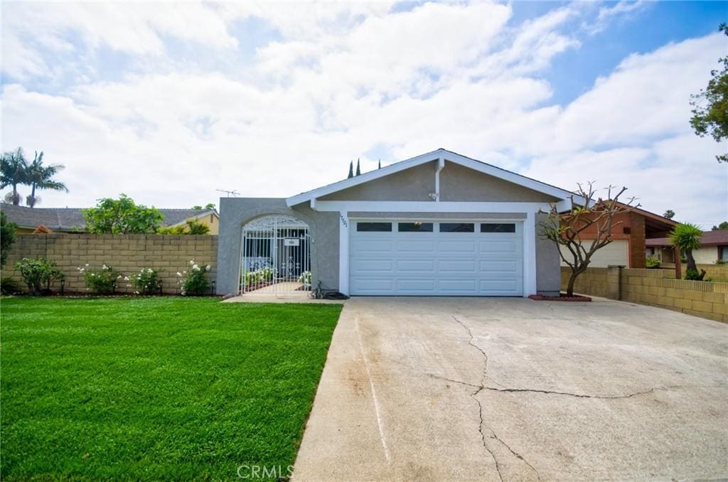 17721 Alexander Pl, Cerritos, CA 90703 - ranch-style house with stucco siding, driveway, and an attached garage