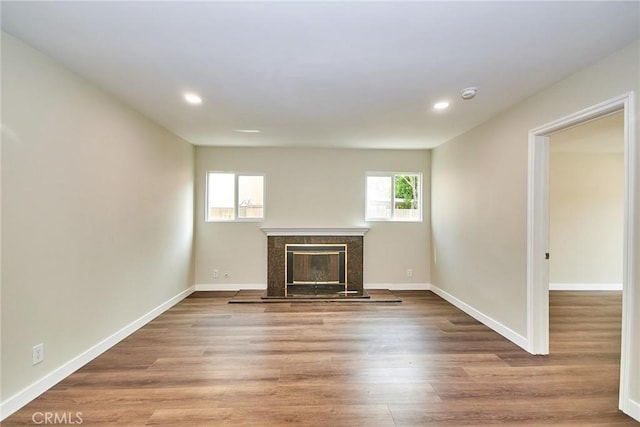 17721 Alexander Pl, Cerritos, CA 90703 - unfurnished living room featuring recessed lighting, a fireplace, baseboards, and wood finished floors