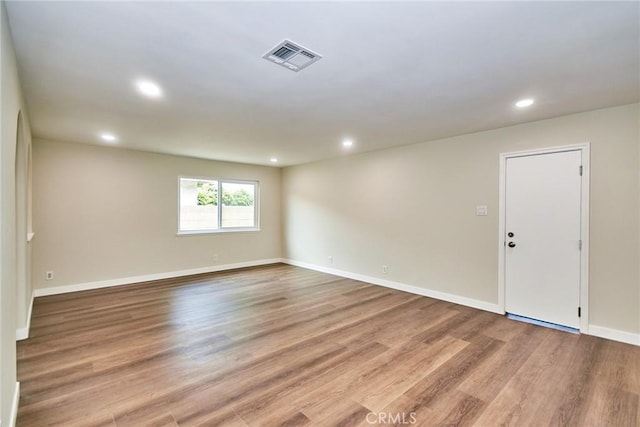 17721 Alexander Pl, Cerritos, CA 90703 - empty room with wood finished floors, recessed lighting, and baseboards