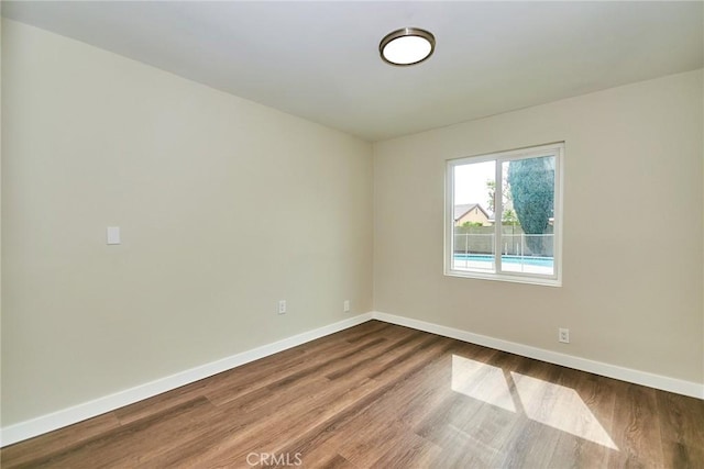 17721 Alexander Pl, Cerritos, CA 90703 - empty room with baseboards and dark wood-style flooring