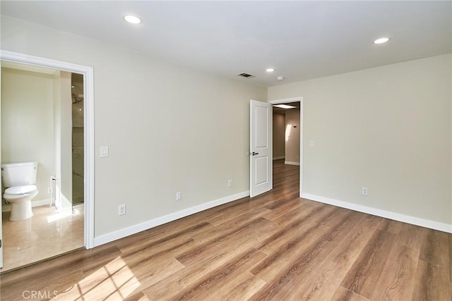 17721 Alexander Pl, Cerritos, CA 90703 - unfurnished bedroom with wood finished floors, recessed lighting, baseboards, and connected bathroom
