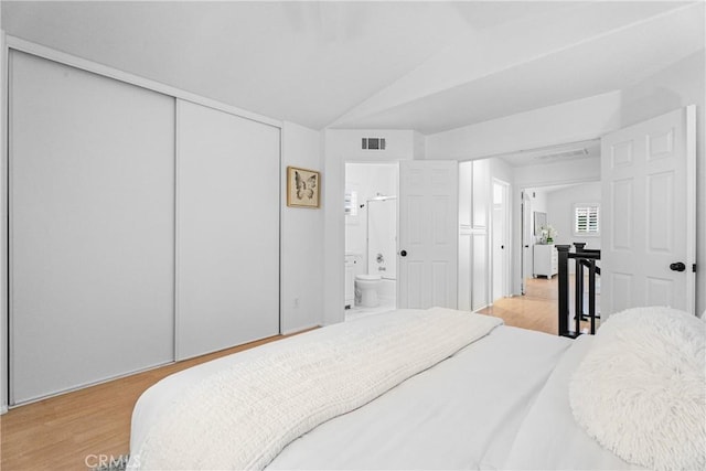 2 Chestnut Dr, Aliso Viejo, CA 92656 - bedroom featuring wood finished floors, ensuite bath, and lofted ceiling