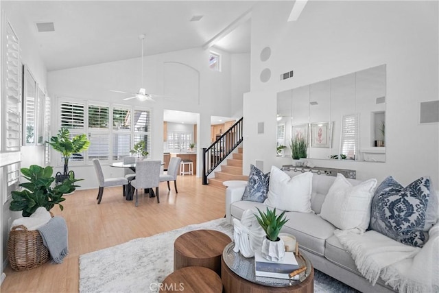 2 Chestnut Dr, Aliso Viejo, CA 92656 - living area featuring wood finished floors, stairs, a ceiling fan, and high vaulted ceiling