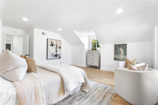 109 Loyola, Seal Beach, CA 90740 - bedroom with light wood-type flooring, recessed lighting, vaulted ceiling, and baseboards