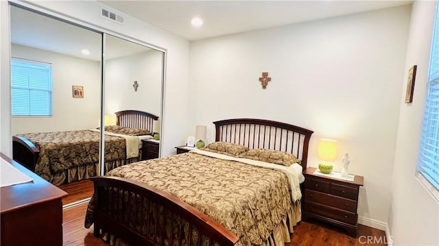 2652 W Madison Cir, Anaheim, CA 92801 - bedroom with wood finished floors, multiple windows, a closet, recessed lighting, and baseboards