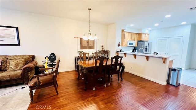 2652 W Madison Cir, Anaheim, CA 92801 - dining room with a chandelier, wood finished floors, baseboards, and recessed lighting