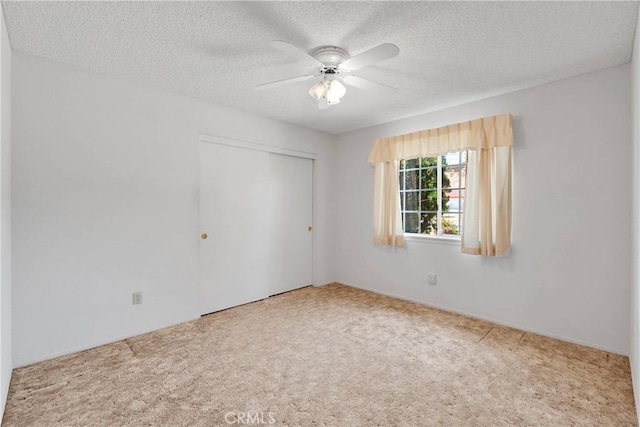 7621 Alston Ave, Hesperia, CA 92345 - unfurnished bedroom featuring carpet floors, a closet, a textured ceiling, and ceiling fan