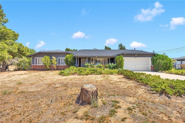 7621 Alston Ave, Hesperia, CA 92345 - single story home with brick siding, an attached garage, and driveway
