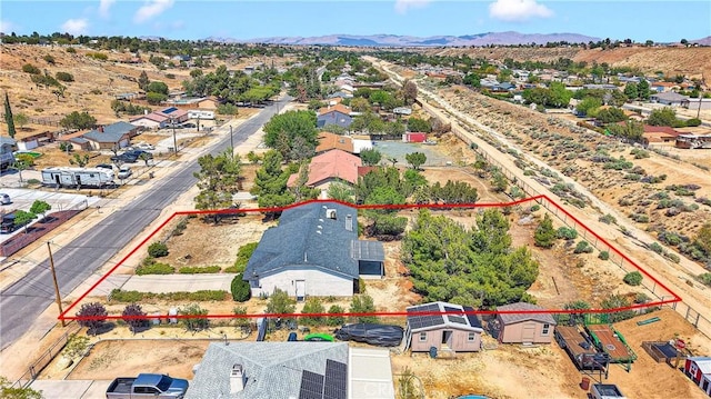 7621 Alston Ave, Hesperia, CA 92345 - aerial view of residential area with property parcel outlined and a mountain backdrop