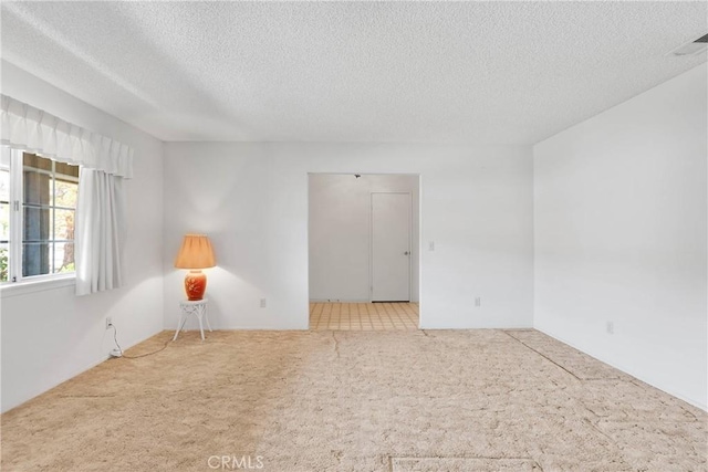 7621 Alston Ave, Hesperia, CA 92345 - carpeted empty room featuring a textured ceiling