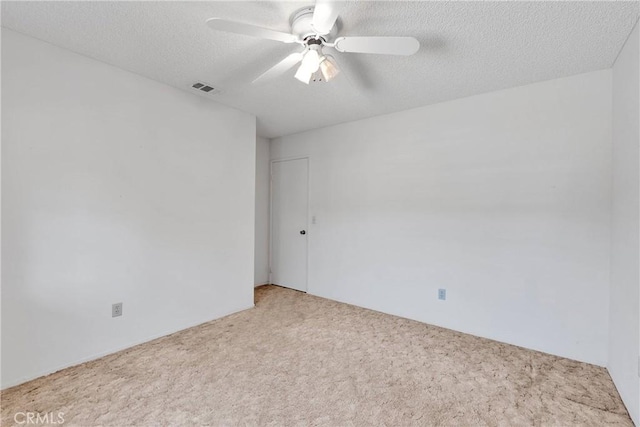 7621 Alston Ave, Hesperia, CA 92345 - unfurnished room with carpet flooring, ceiling fan, and a textured ceiling