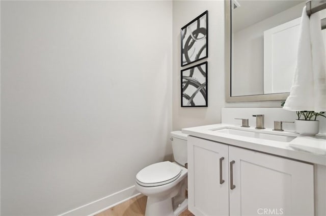 56 Chasma, Irvine, CA 92618 - bathroom featuring baseboards, vanity, toilet, and wood finished floors