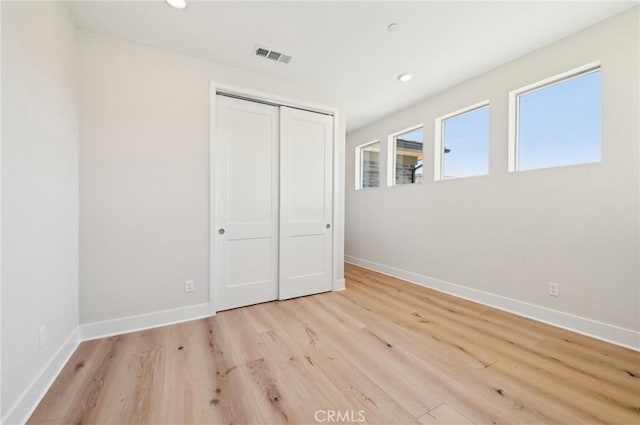 56 Chasma, Irvine, CA 92618 - unfurnished bedroom featuring baseboards, light wood finished floors, a closet, and recessed lighting