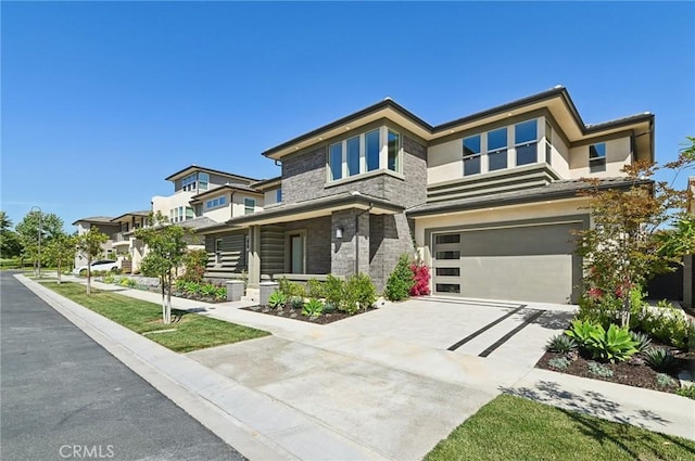56 Chasma, Irvine, CA 92618 - view of front facade featuring a garage, driveway, and stone siding