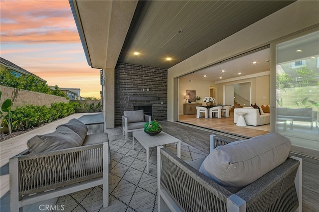 56 Chasma, Irvine, CA 92618 - patio terrace at dusk featuring outdoor lounge area and fence