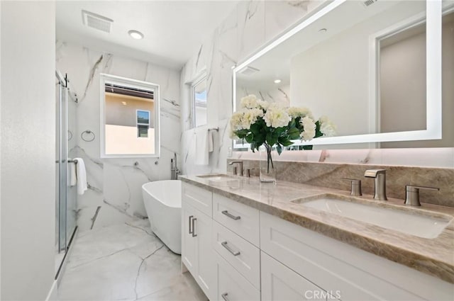 56 Chasma, Irvine, CA 92618 - bathroom featuring marble look tiles, a freestanding bath, and double vanity