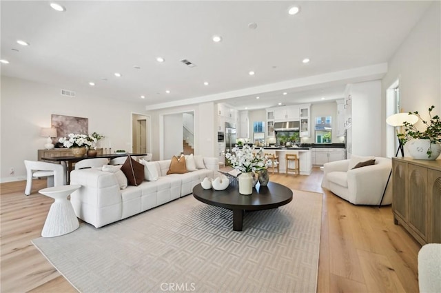 56 Chasma, Irvine, CA 92618 - living area with light wood-style flooring and recessed lighting
