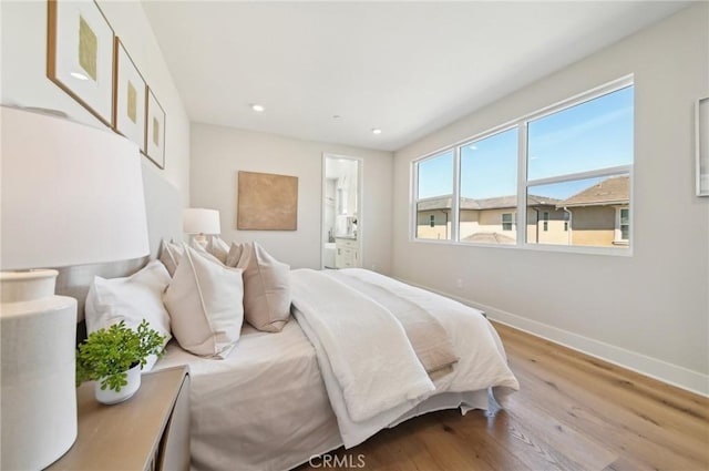 56 Chasma, Irvine, CA 92618 - bedroom featuring wood finished floors, baseboards, recessed lighting, and ensuite bathroom