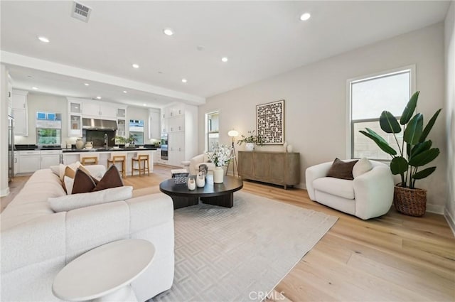 56 Chasma, Irvine, CA 92618 - living room with light wood-style flooring, recessed lighting, and baseboards