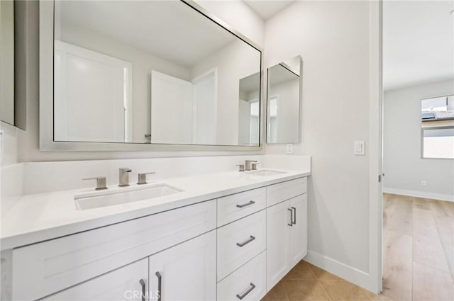 56 Chasma, Irvine, CA 92618 - bathroom with baseboards and double vanity
