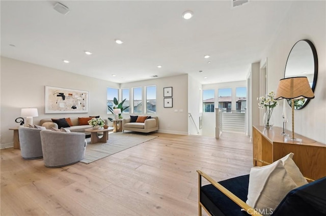 56 Chasma, Irvine, CA 92618 - living room with light wood-type flooring, baseboards, and recessed lighting