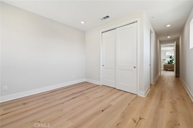 56 Chasma, Irvine, CA 92618 - unfurnished bedroom with light wood-style floors, baseboards, a closet, and recessed lighting