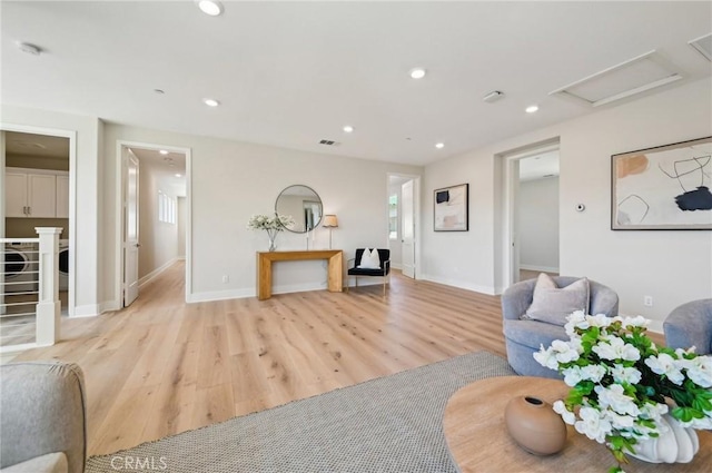 56 Chasma, Irvine, CA 92618 - living room with light wood-style flooring, attic access, baseboards, and recessed lighting