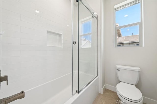 56 Chasma, Irvine, CA 92618 - full bath featuring baseboards, bath / shower combo with glass door, toilet, and tile patterned flooring