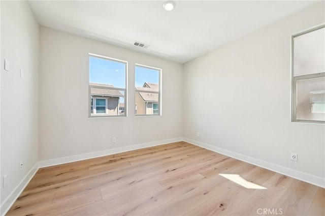 56 Chasma, Irvine, CA 92618 - unfurnished room with light wood finished floors and baseboards