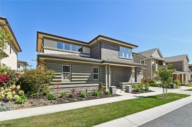 56 Chasma, Irvine, CA 92618 - view of front facade with a front yard and brick siding