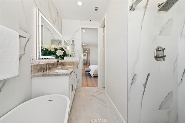 56 Chasma, Irvine, CA 92618 - full bath with vanity, a marble finish shower, a freestanding tub, ensuite bath, and marble finish flooring