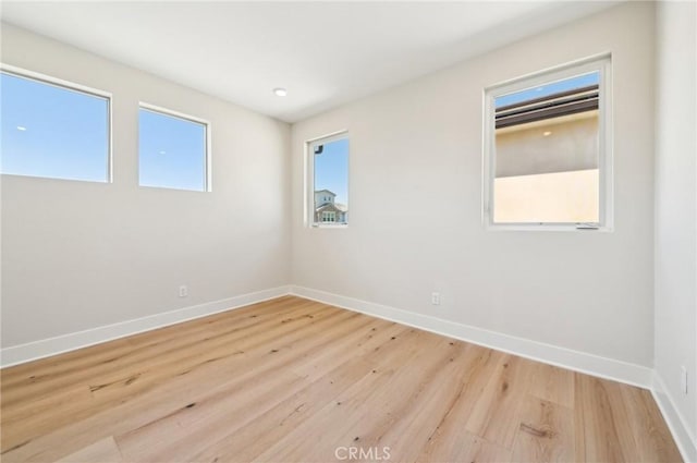 56 Chasma, Irvine, CA 92618 - spare room featuring light wood-type flooring and baseboards