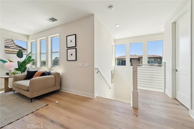 56 Chasma, Irvine, CA 92618 - sitting room with an upstairs landing, baseboards, light wood-type flooring, and recessed lighting