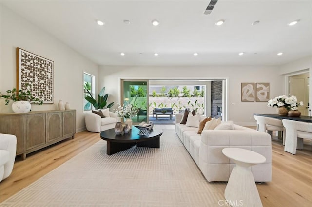 56 Chasma, Irvine, CA 92618 - living area featuring light wood finished floors, plenty of natural light, recessed lighting, and baseboards