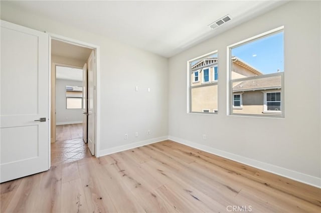 56 Chasma, Irvine, CA 92618 - empty room featuring baseboards and light wood-style floors