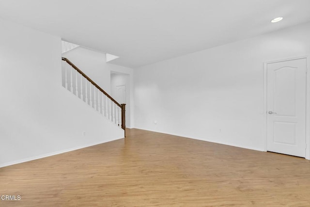 40197 Gallatin Ct, Temecula, CA 92591 - unfurnished living room featuring stairway, light wood-style floors, baseboards, and recessed lighting