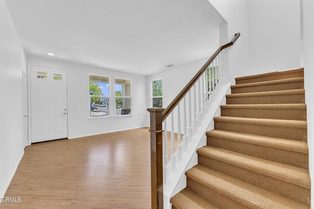 40197 Gallatin Ct, Temecula, CA 92591 - entrance foyer featuring wood finished floors, stairs, baseboards, and recessed lighting