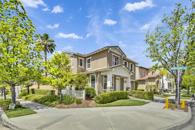40197 Gallatin Ct, Temecula, CA 92591 - view of side of home with stucco siding, fence, and a residential view