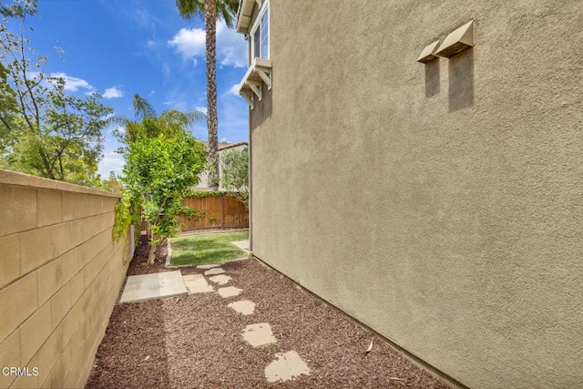 40197 Gallatin Ct, Temecula, CA 92591 - view of side of home featuring fence and stucco siding