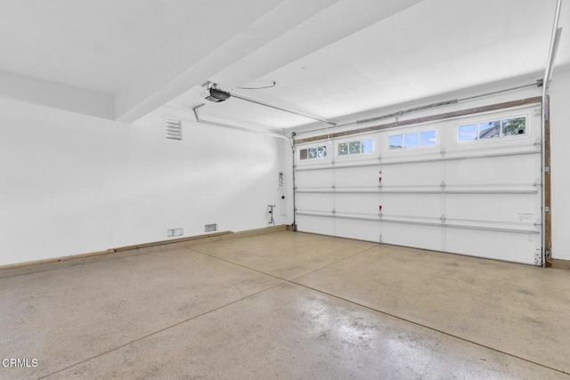 40197 Gallatin Ct, Temecula, CA 92591 - garage featuring a garage door opener and baseboards