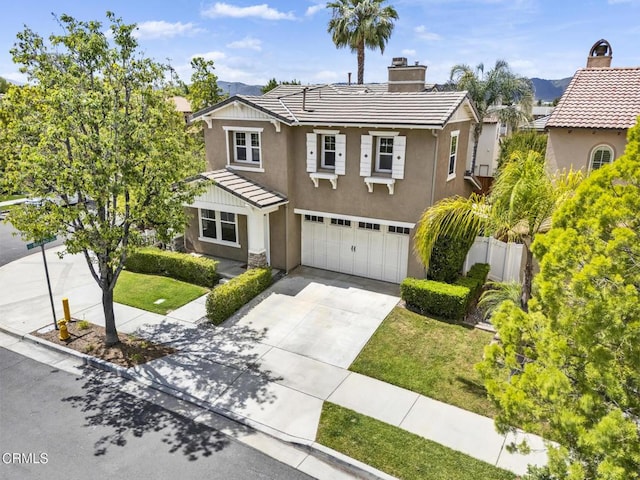 40197 Gallatin Ct, Temecula, CA 92591 - traditional home featuring stucco siding, a garage, concrete driveway, a chimney, and a mountain view